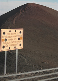 Trail to Pu'u Wekiu, high point on Mauna Kea summit; sign reads 'This Slope Extremely Dangerous When Icy | Do Not Enter When Ice Is Present'