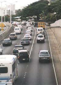 Approaching an entrance ramp, with Botts dots marking the three lanes and a white stripe on the left side of the dots between the #2 and #3 lanes