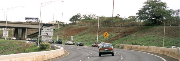 Left entrance from southbound H-2 onto eastbound H-1, with left exit onto H-1 HOV lane