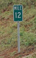 Milepost 12 on H-3, with horizontal rather than usual vertical number