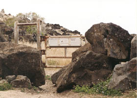 Gate blocking vehicle access to Kaena Point