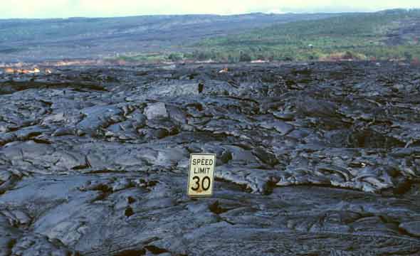 30 mph speed limit sign, embedded in hardened pahoehoe lava almost up to bottom of sign
