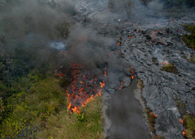 Lava flowing down Royal Avenue, after covering the intersection with Paradise Street, with the stop sign there still visible