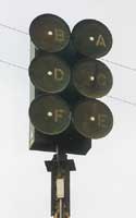 Civil defense sirens A-F, two columns of three dark horns all facing forward