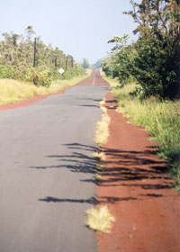 Red Road facing north, as new black pavement changes to old red pavement